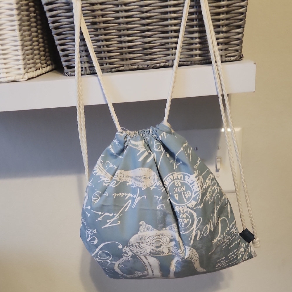 Elegant Blue Script Drawstring Backpack - image 1